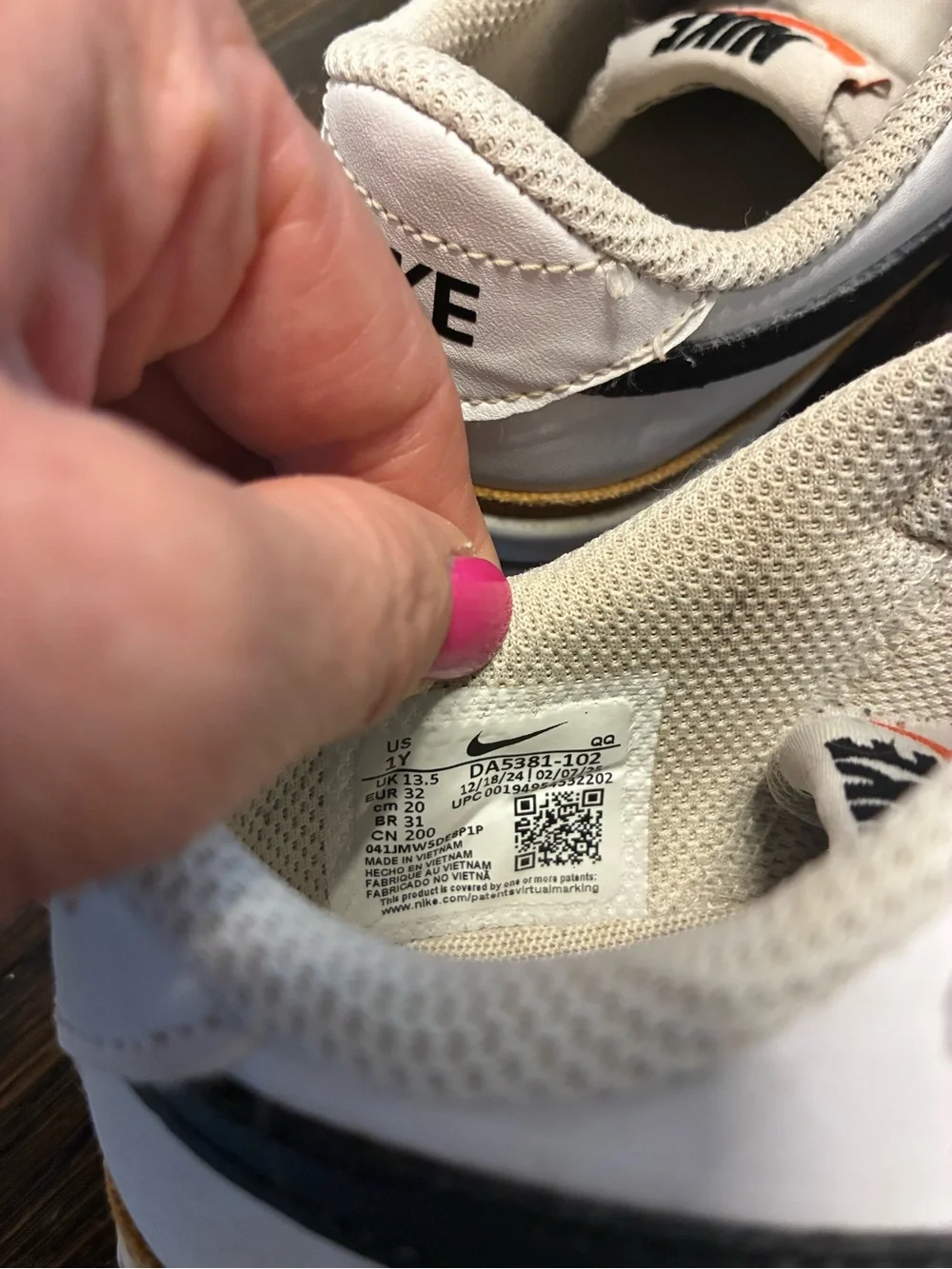 Nike Kids White Sneakers with Black Swoosh and Tan Trim